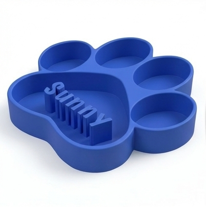 Blue paw-shaped dog bowl with 'Sunny' text on a white background