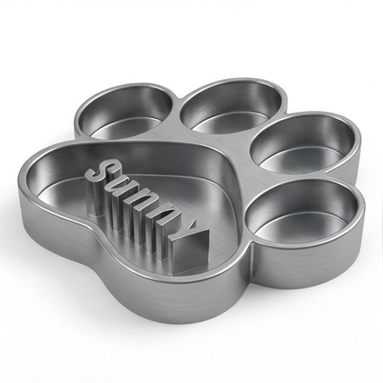Gray paw-shaped dog bowl with 'Sunny' text on a white background