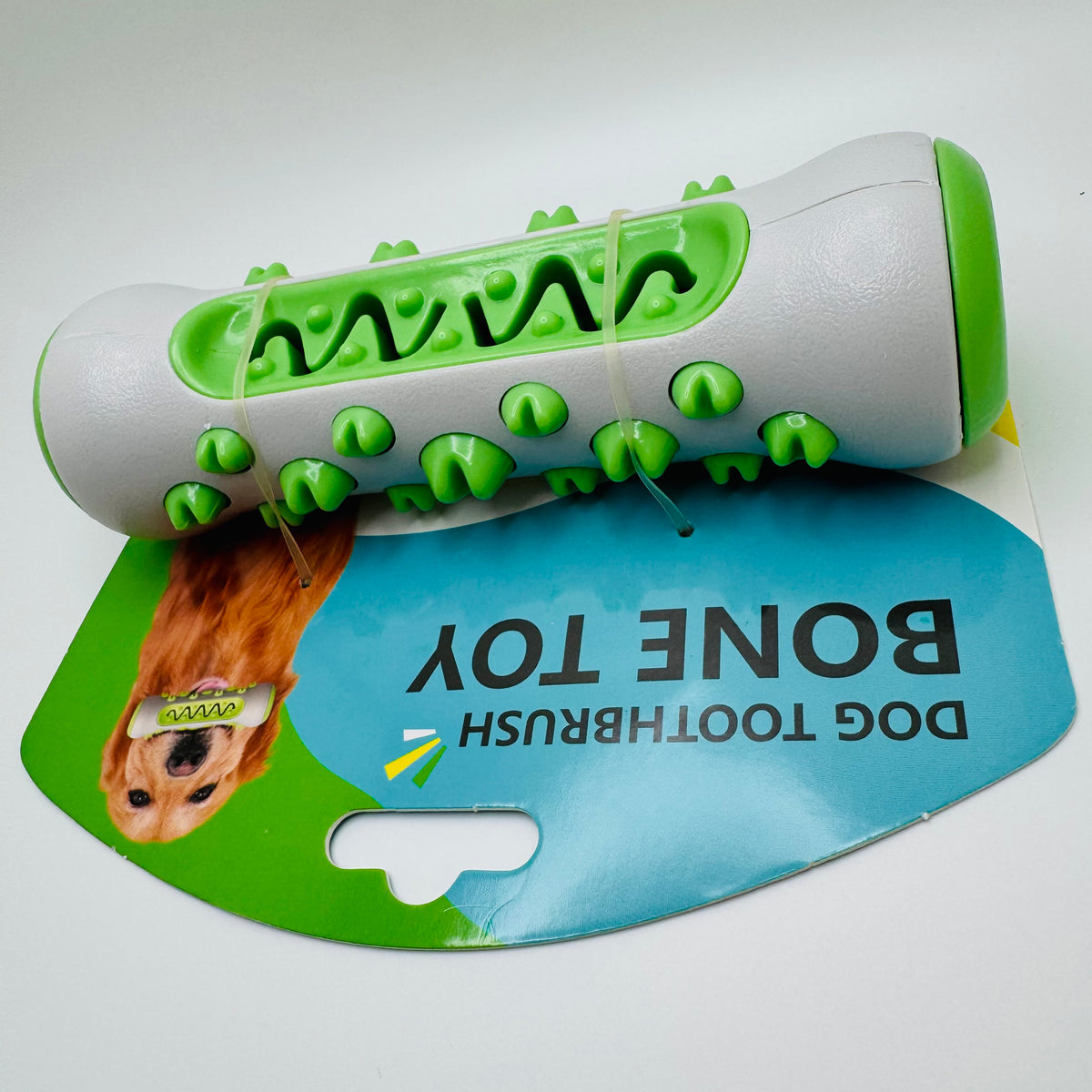 Green Molar Chew & Dental Toy for dogs with a wavy cleaning channel on its backing card