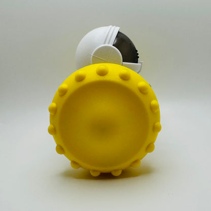 Yellow Robot Slow Feeder & Treat Dispenser Toy, side view of the spiked wheel