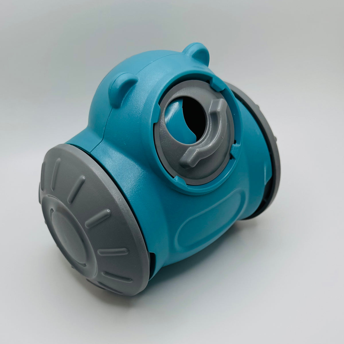 Teal Bear Slow Feeder & Treat Dispensing Toy for dogs, three-quarter view with grey wheel