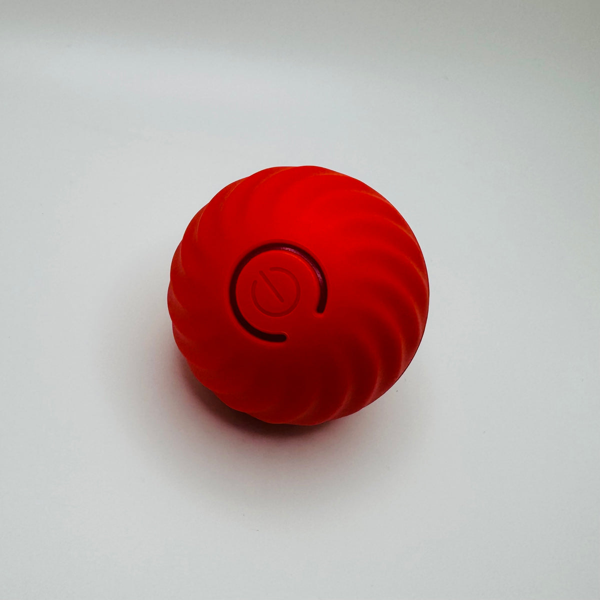 Red USB Vibrating Ball Toy for dogs and cats with glowing power button