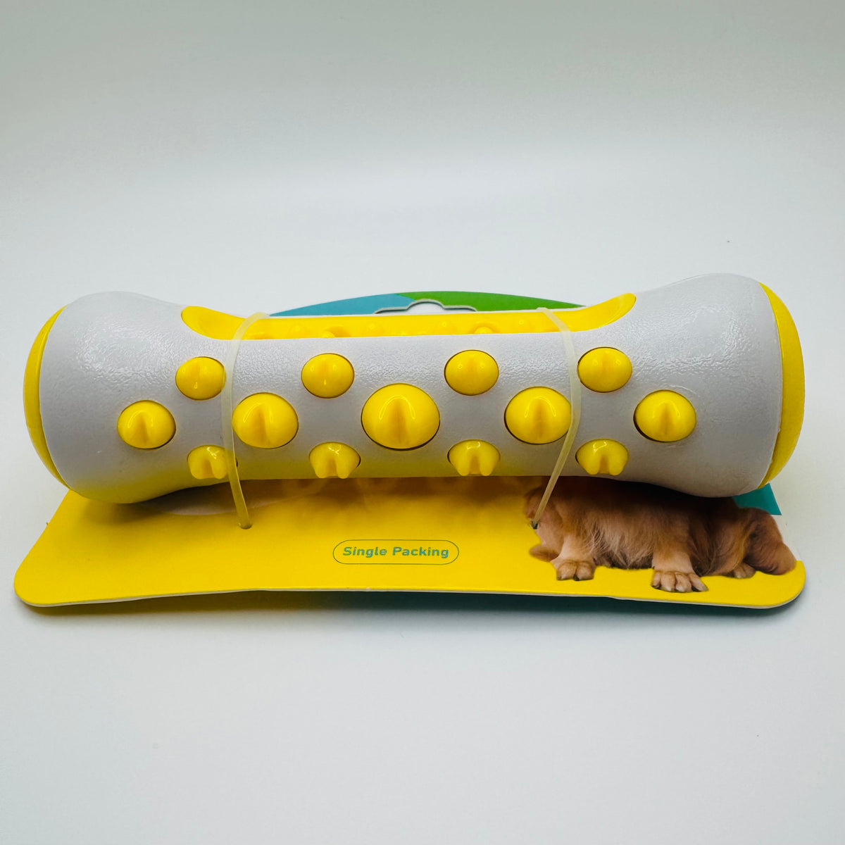 Yellow Molar Chew & Dental Toy for dogs with large yellow bumps, on its packaging