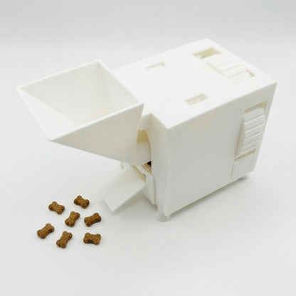 White interactive pet food slow feeder with scattered kibble on a white background