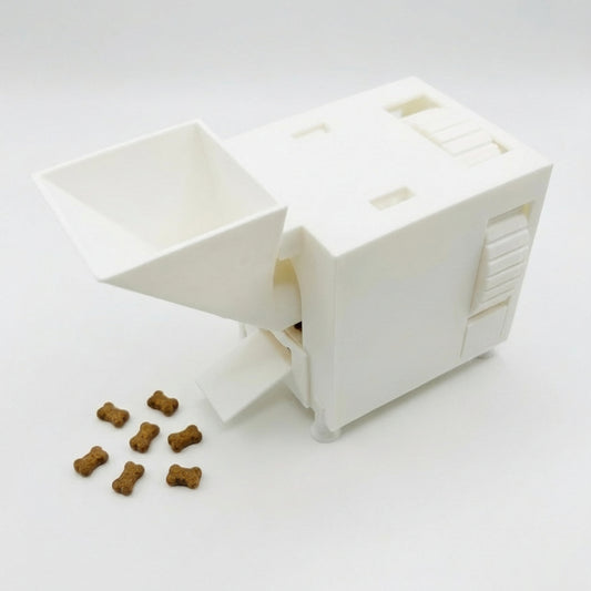 White interactive pet food slow feeder with scattered kibble on a white background