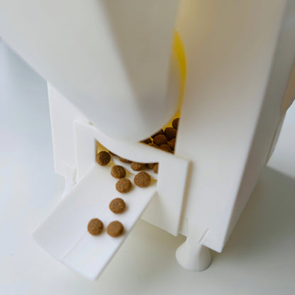 rotary interactive slow feeder with kibbles in it