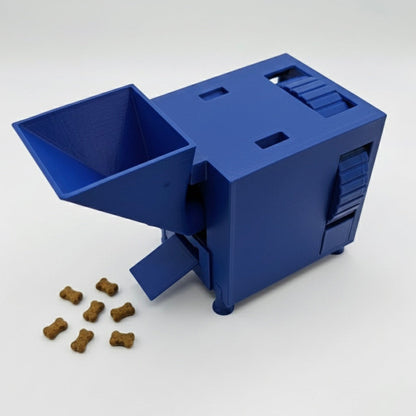 Blue interactive pet food dispenser with scattered kibble on a white background