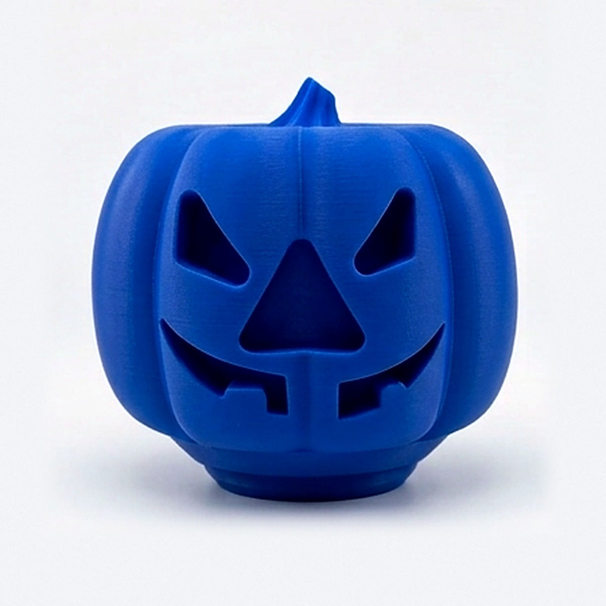Blue pumpkin treat dispenser for dogs and cats with carved jack-o'-lantern face