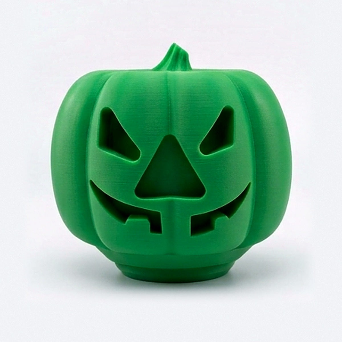 Green pumpkin treat dispenser for dogs and cats with carved jack-o'-lantern face