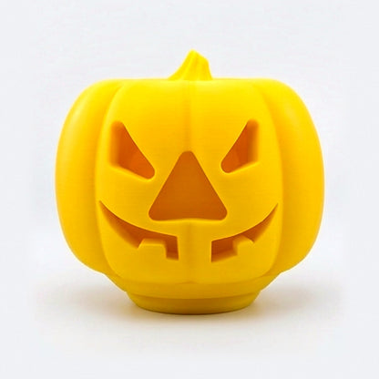 Yellow pumpkin treat dispenser for dogs and cats with carved jack-o'-lantern face