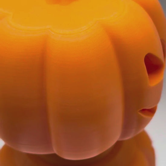 Jack-o'-Treat pumpkin treat dispenser video: fill it with treats through the bottom plug, screw it shut and let your pet roll it, available in 2 sizes