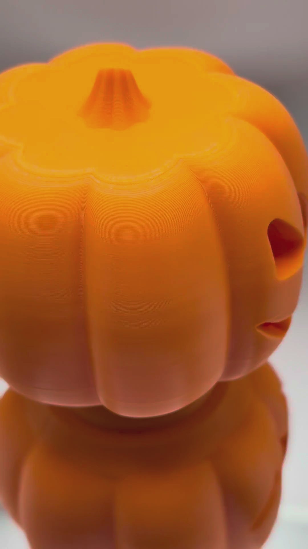 Jack-o'-Treat pumpkin treat dispenser video: fill it with treats through the bottom plug, screw it shut and let your pet roll it, available in 2 sizes